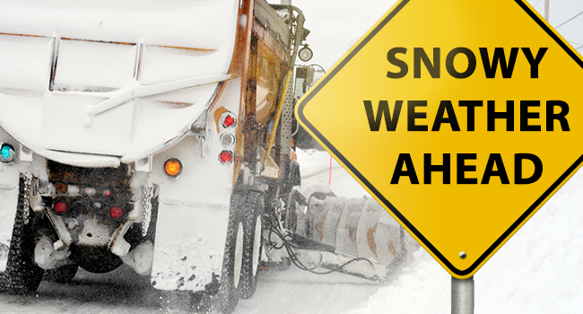 Road Sign reading Snowy Weather Ahead