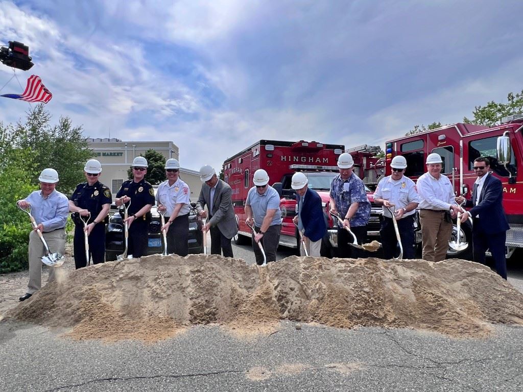 Groundbreaking people with shovels and hardhats